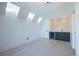 Bonus room with wet bar, skylights, and wood flooring at 2200 Newton St, Denver, CO 80211