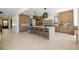 Open concept kitchen with light wood flooring and modern cabinetry at 2200 Newton St, Denver, CO 80211