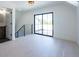 Bright bonus room with private balcony access and hardwood floors at 2200 Newton St, Denver, CO 80211