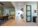 Bright hallway with modern light fixtures and hardwood floors at 2200 Newton St, Denver, CO 80211