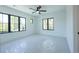 Bright bedroom with large windows and plush carpeting at 2200 Newton St, Denver, CO 80211