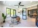 Home office with large window, hardwood floors, and built-in desk at 2200 Newton St, Denver, CO 80211