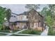 Two-story brick home with a front porch and yard at 2200 Newton St, Denver, CO 80211