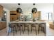 Modern kitchen with island, stainless steel appliances, and light wood cabinets at 2200 Newton St, Denver, CO 80211
