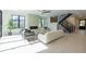Spacious living room with hardwood floors and a modern fireplace at 2200 Newton St, Denver, CO 80211