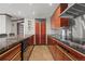 Modern kitchen with granite countertops and wood cabinets at 1020 15Th St # 20J, Denver, CO 80202