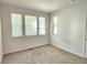 Spacious bedroom with neutral carpeting and large windows at 6435 E Cedar Ave, Denver, CO 80224