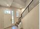 Bright entryway with tiled floors and modern staircase at 6435 E Cedar Ave, Denver, CO 80224