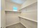 Large walk-in closet with double hanging rods and shelving at 6435 E Cedar Ave, Denver, CO 80224