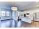 Modern kitchen featuring white cabinetry, granite countertops, and stainless steel appliances at 6435 E Cedar Ave, Denver, CO 80224