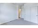 Bright bedroom with double closets and access to a full bathroom at 6435 E Cedar Ave, Denver, CO 80224