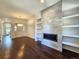 Living room with a modern fireplace and built-in shelving at 6435 E Cedar Ave, Denver, CO 80224