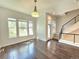 Light-filled dining area with hardwood floors and access to a deck at 6435 E Cedar Ave, Denver, CO 80224