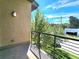 Private balcony with metal railing and city views at 6435 E Cedar Ave, Denver, CO 80224