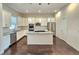 Modern kitchen with stainless steel appliances and an island at 6435 E Cedar Ave, Denver, CO 80224