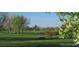 Landscaped park with playground and open green space at 6435 E Cedar Ave, Denver, CO 80224
