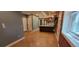 Open living area with exposed brick and kitchen island at 1356 N Pearl St # B2, Denver, CO 80203