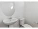 Clean bathroom with pedestal sink and toilet at 426 Millwall Cir, Castle Pines, CO 80108