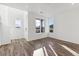 Open concept living room with hardwood floors and natural light at 426 Millwall Cir, Castle Pines, CO 80108