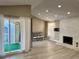 Living room with fireplace and access to a private balcony at 3414 S Locust St # D, Denver, CO 80222