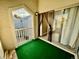 Private balcony with artificial turf and views of the courtyard at 3414 S Locust St # D, Denver, CO 80222