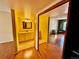 Bright bathroom with yellow vanity and mirrored medicine cabinet at 3414 S Locust St # D, Denver, CO 80222