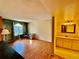 Home office with wood floors and built-in shelving at 3414 S Locust St # D, Denver, CO 80222