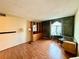 Home office with wood floors and built-in shelving at 3414 S Locust St # D, Denver, CO 80222