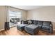 Cozy living room with L-shaped sofa and access to a patio at 9901 E Evans Ave # 7D, Aurora, CO 80247