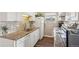 Well-equipped kitchen featuring granite countertops and white cabinets at 9901 E Evans Ave # 7D, Aurora, CO 80247
