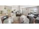 Open living room and kitchen with a comfy sectional sofa at 9901 E Evans Ave # 7D, Aurora, CO 80247