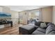 Comfortable living room with L-shaped sofa and sliding glass doors to a deck at 9901 E Evans Ave # 7D, Aurora, CO 80247