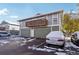 Exterior view of a townhome with a private garage and balcony at 9901 E Evans Ave # 7D, Aurora, CO 80247