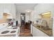 Modern kitchen with granite countertops and white cabinets at 9901 E Evans Ave # 7D, Aurora, CO 80247