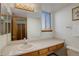 Bright bathroom with single sink vanity and large mirror at 926 Highland Park Dr, Broomfield, CO 80020