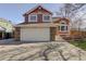 Two-story house with attached garage and landscaping at 926 Highland Park Dr, Broomfield, CO 80020