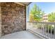 Stone-walled balcony overlooking landscaped yard and neighborhood at 8200 E 8Th Ave # 8101, Denver, CO 80230