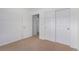 Well-lit bedroom with double door closet and neutral walls at 8200 E 8Th Ave # 8101, Denver, CO 80230