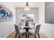 Bright dining area featuring a glass table and four chairs at 8200 E 8Th Ave # 8101, Denver, CO 80230