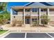 Tan building exterior with stone accents and landscaping at 8200 E 8Th Ave # 8101, Denver, CO 80230