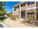 Two-story building exterior with stone and tan siding at 8200 E 8Th Ave # 8101, Denver, CO 80230