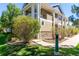 Side view of townhome showcasing landscaping and walkway at 8200 E 8Th Ave # 8101, Denver, CO 80230