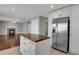 Spacious kitchen with stainless steel refrigerator and island at 3511 Brushwood Dr, Castle Rock, CO 80109