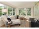 Relaxing sunroom with chaise lounge and ample natural light at 1680 S Clarkson St, Denver, CO 80210