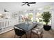 Sunroom dining area with large table and access to backyard at 1680 S Clarkson St, Denver, CO 80210