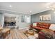 Living room with leather sectional sofa and view to dining area at 7208 Tamarac Ct, Parker, CO 80134