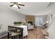 Living room with stone fireplace, hardwood floors, and comfy seating at 10852 Summerset Way, Parker, CO 80138