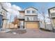 Two-story home with attached garage and modern exterior at 4871 Halifax Ct, Denver, CO 80249