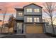 Modern two story house with attached garage at 4871 Halifax Ct, Denver, CO 80249