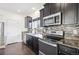 Modern kitchen with stainless steel appliances at 4871 Halifax Ct, Denver, CO 80249